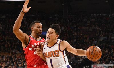 NBA: Devin Booker of the Phoenix Suns hurts against the Toronto Raptors